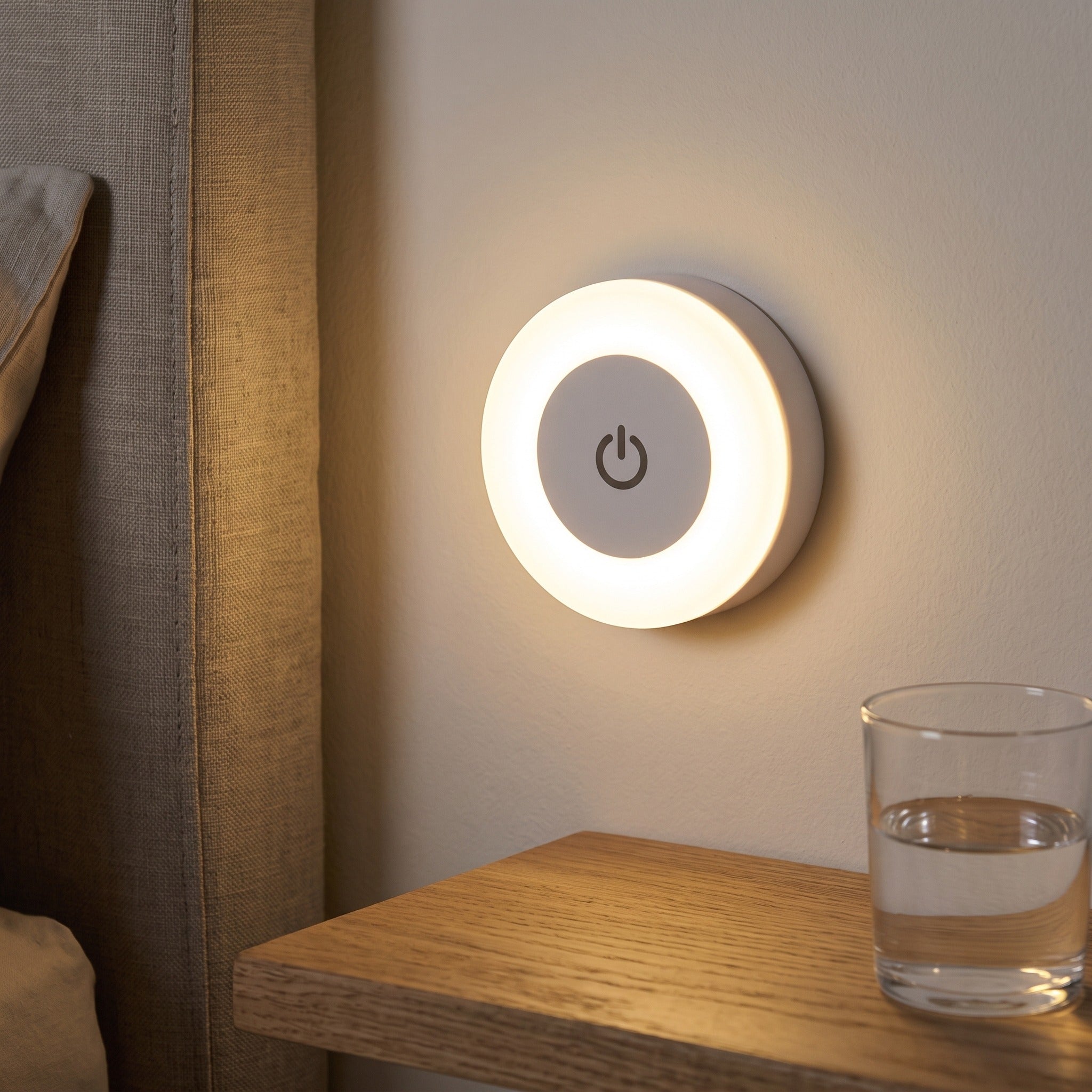 Little Glow Warm White Lamp Beside A Bed